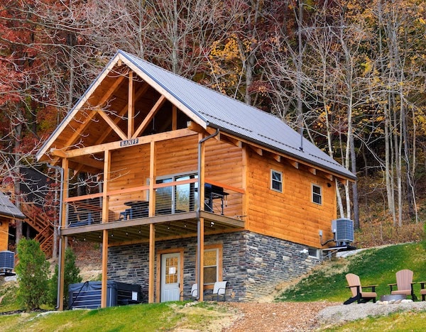 Enjoy a serene getaway in a luxury mini-lodge cabin located on picturesque Tappan Lake, complete with a spacious deck for you to soak in the tranquil surroundings.