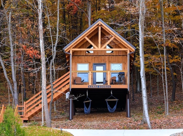 A midsize luxury cabin in the woods with a swing, available for cabin rental at Tappan Lakeside Resort near Tappan Lake.